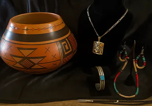 Handcrafted Hopi pottery and silver jewelry with turquoise and beaded adornments
